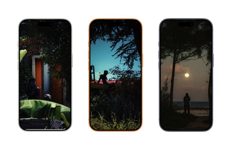 Free HD iPhone wallpaper — dark tropical street scene with trees and hidden light, Malé, Maldives